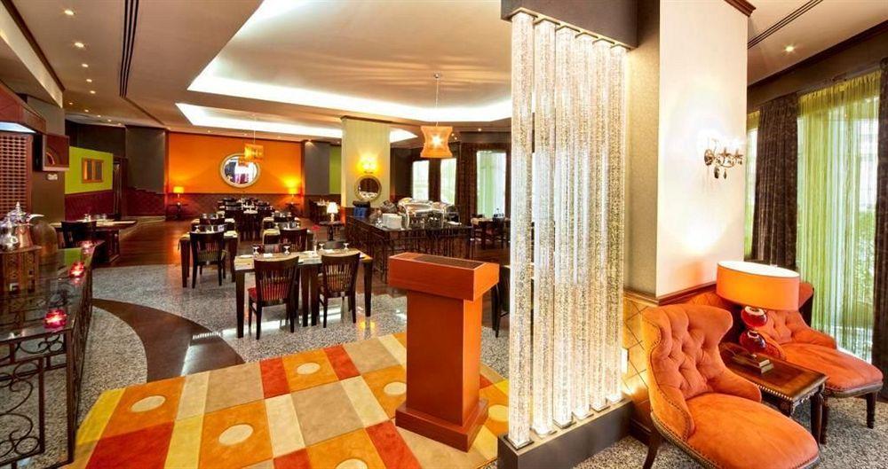 فندق Coral Oriental دبي المطعم الصورة